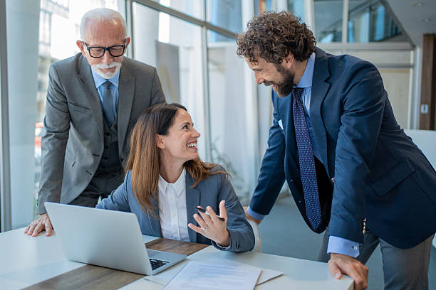 istock Business team discussing work at laptop in office 2228556426