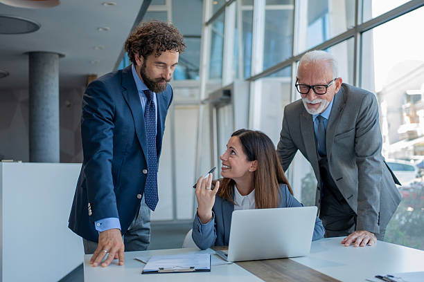 istock Business team working together on a project using laptop in modern office 2228556440