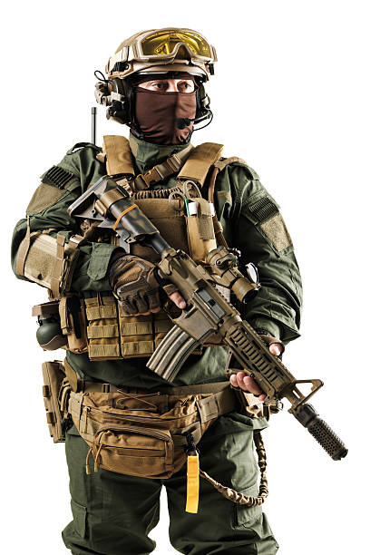 istock Tactical armed soldier wearing military gear and holding a modern firearm 2228558376