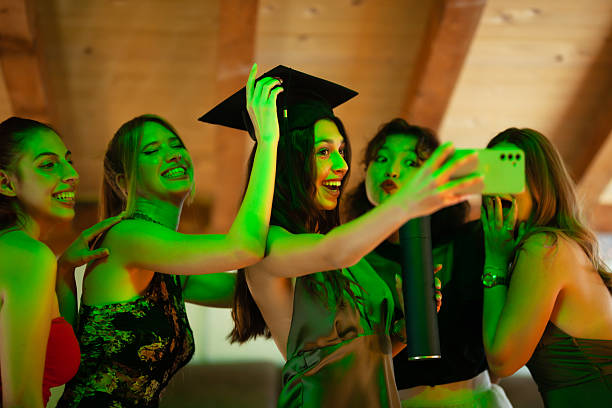 istock Young graduates celebrating with a selfie after their ceremony in a joyful setting 2228558640