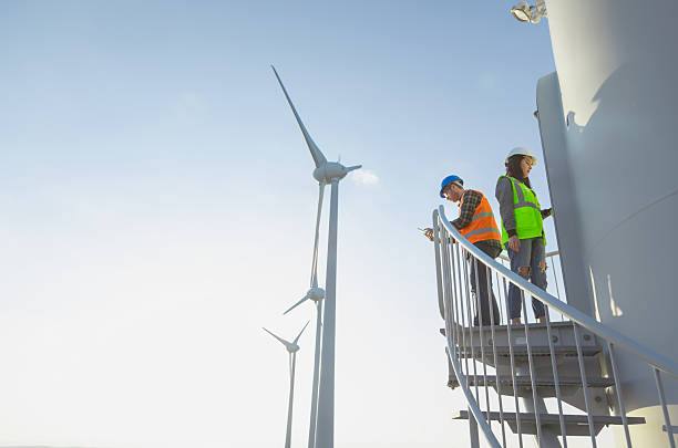 istock Engineers Inspecting Wind Turbine Tower Stairs at a Modern Renewable Energy Facility 2228560467