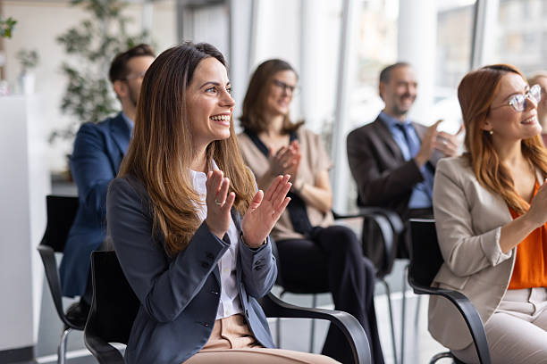 istock Focused Individuals Applauding in an Office Setting 2228560590