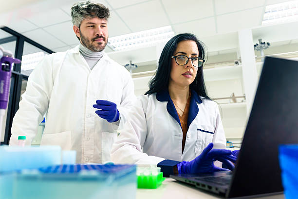 istock Latin american scientists working with laptop in laboratory 2228562018