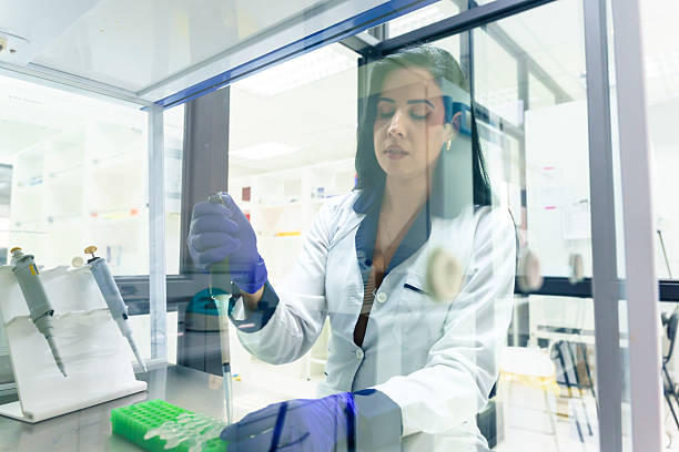 istock Latin american scientist working with micropipette in laboratory 2228562089