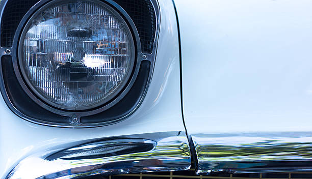 istock Headlights on Vintage White '50s Car Close-Up 2228571603
