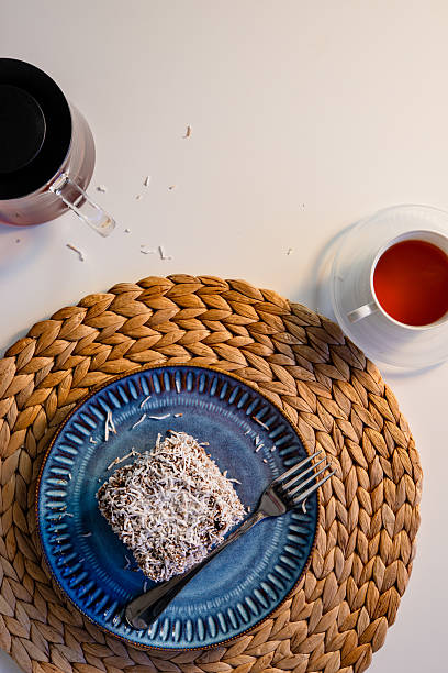 Lamington on a Woven Placemat with Tea