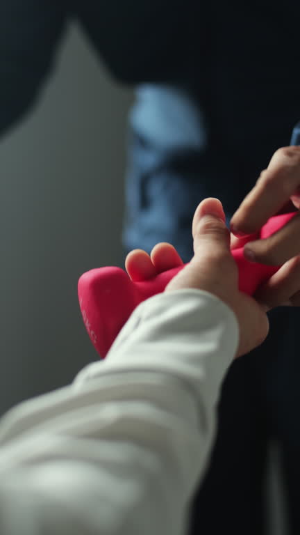 Trainer guiding mature woman.