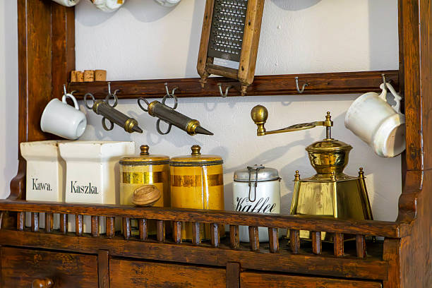 Old gilded kettle on an iron stove