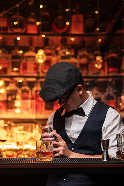istock Bartender is pouring whiskey into a glass in a restaurant 2228587853