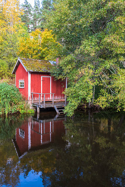 istock Idyllic cottage with beautiful reflections in the water 2228588360