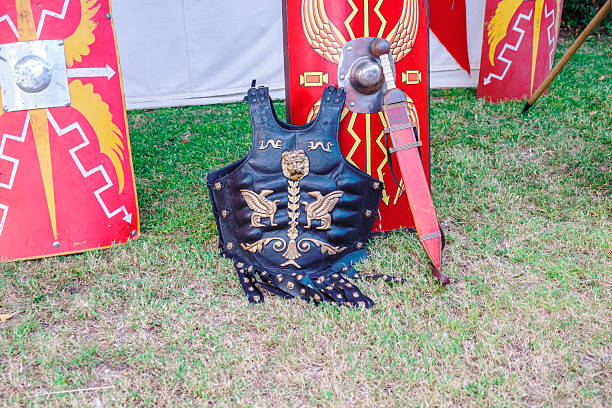 istock Ornate Roman Cuirass and Sword with Scutum Shields 2228590116