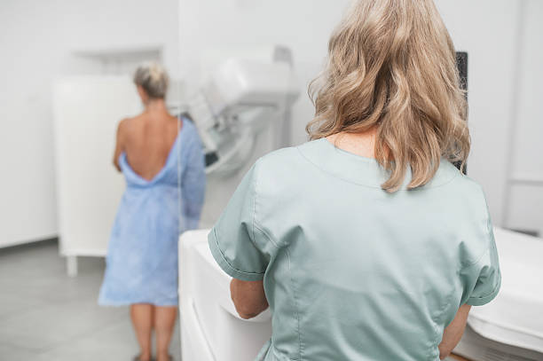 istock A nurse helps a patient undergo a mammogram procedure. 2228590671