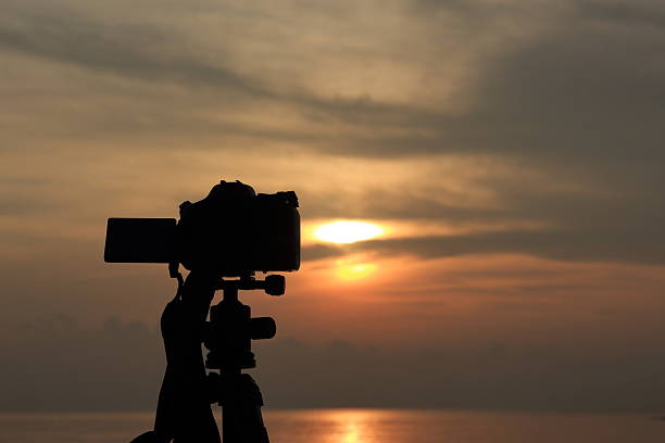 istock Sunrise with DLSR camera and tripod 2228590912