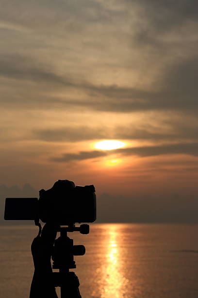 istock Sunrise with DLSR camera and tripod 2228590919