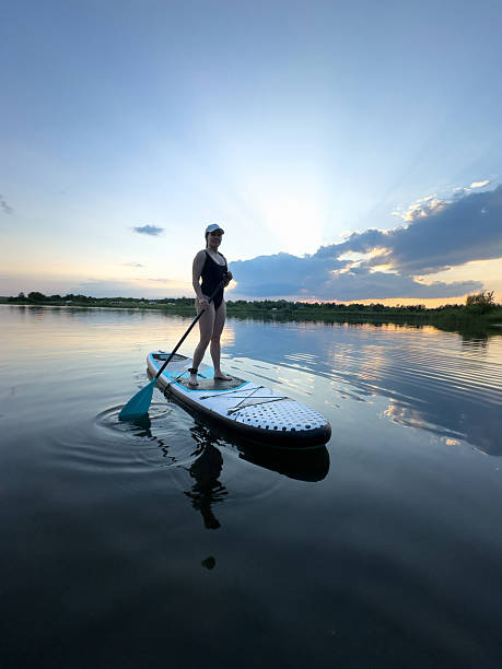 istock Paddleboarding at Sunset on a Tranquil Lake 2228592692