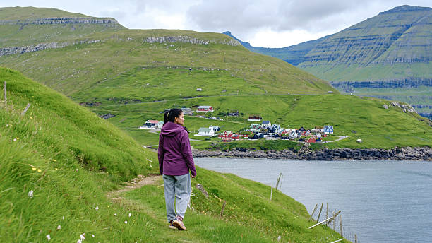 istock Discovering the serene coastal path in the stunning Faroe Islands landscape 2228593127