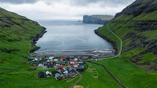 istock Breathtaking coastal village nestled between dramatic cliffs in the Faroe Islands 2228594794