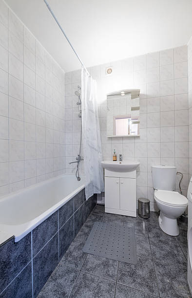 istock Home Bathroom Interior with Washing Machine and Elegant White Fixtures 2228595279