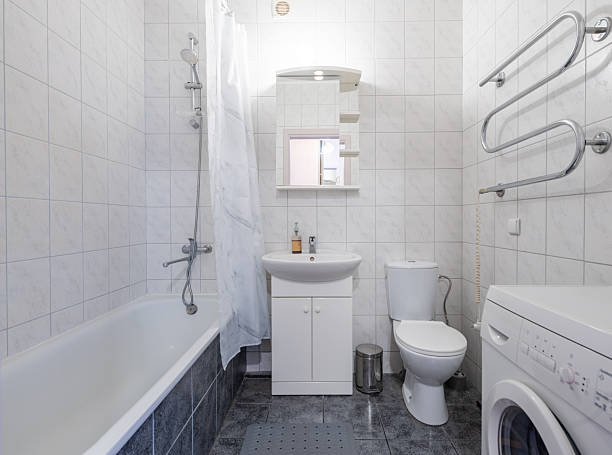 istock Home Bathroom Interior with Washing Machine and Elegant White Fixtures 2228595292