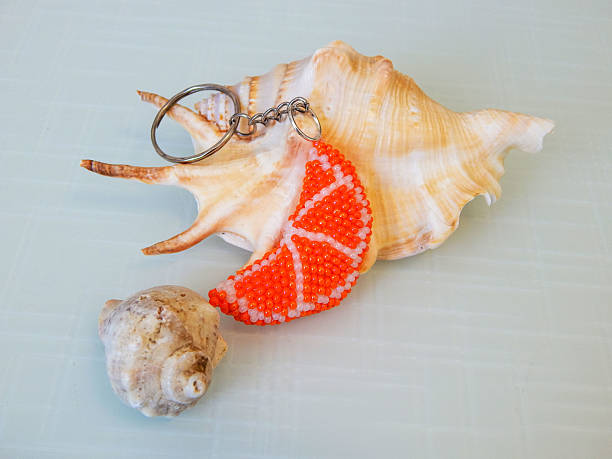 istock Bead colorful key chain and sea coast 2228597370
