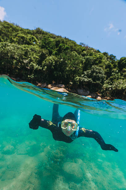 istock Young diver exploring underwater marine life in tropical ocean 2228599277