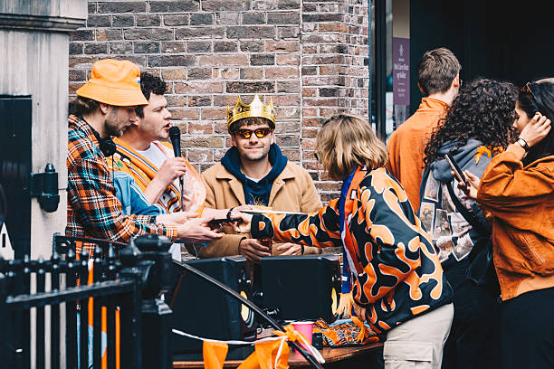 Vilnius, Lithuania - September 21 2025: People browsing vinyl records in wooden crates at a music store or flea market. Close-up of hands flipping through vintage LP albums, symbolizing retro music culture, nostalgia, and collecting