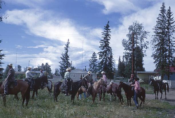 Alberta, Canada, 1964. Countryside. Neighbors on their horses meet before an event in the district town.