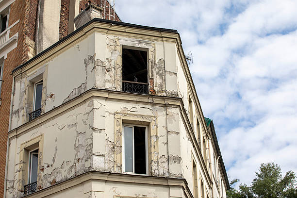 istock Old city apartment building undergoing renovation with a summer sky 2228600176