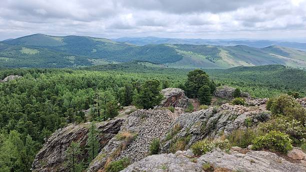 istock Rocky scenery overlooking green Valley in Mongolia 2228600257