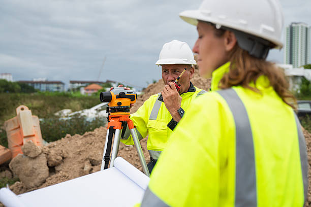 istock The survey team is using a theodolite and road construction plans. Civil engineers are measuring with surveying tools during the construction 2228601767