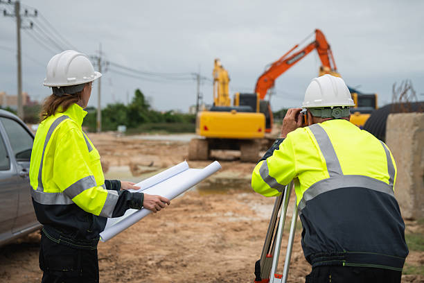 istock The survey team is using a theodolite and road construction plans. Civil engineers are measuring with surveying tools during the construction 2228602062