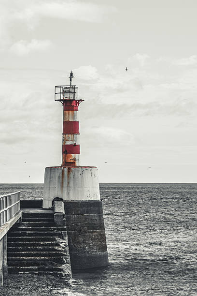 Weathered Lighthouse by the Sea
