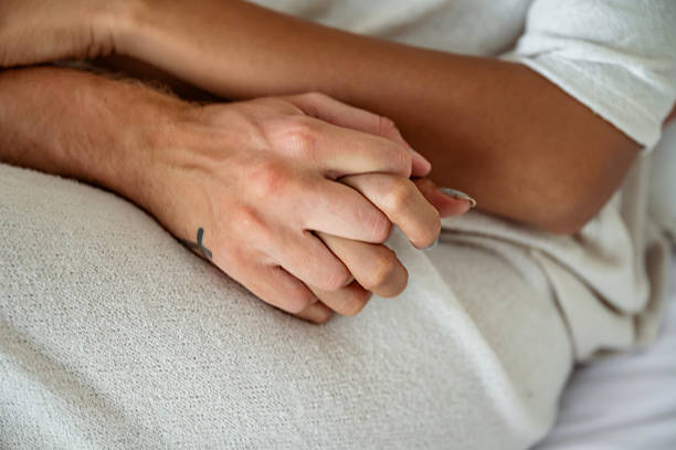 istock Couple Holding Hands in an Intimate and Caring Moment 2228607828
