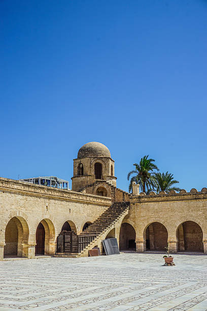 The Great Mosque of Sousse, located in the heart of the Medina in Tunisia, is a remarkable example of Islamic architecture and religious heritage. Built in the 9th century, this ancient mosque served both as a place of worship and a fortress, reflecting the dual nature of defense and spirituality. Its solid stone walls, open courtyard, and lack of a traditional minaret make it a unique historic building. As a sacred site for Muslim prayer and reading of the Quran, it stands as a spiritual center in North Africa. The mosque’s simplicity, cultural treasure, and strong tradition attract tourism, architecture lovers, and those seeking to explore Islamic culture and heritage in this iconic landmark.