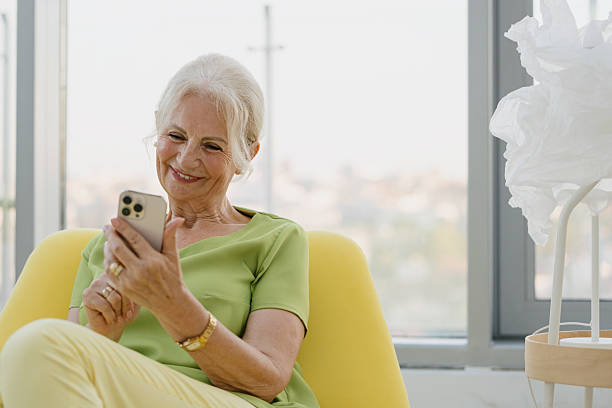 istock Mature Woman Sending Text Messages on Mobile Phone 2228611797