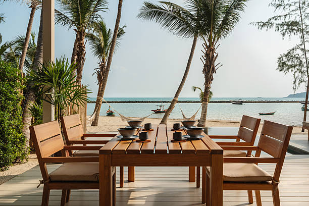 istock Outdoor dining area at a tropical beachfront villa 2228611839