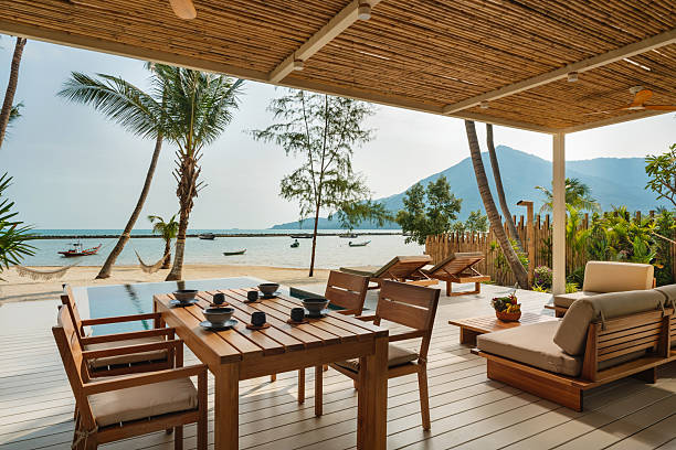 istock Outdoor dining area at a tropical beachfront villa 2228611850