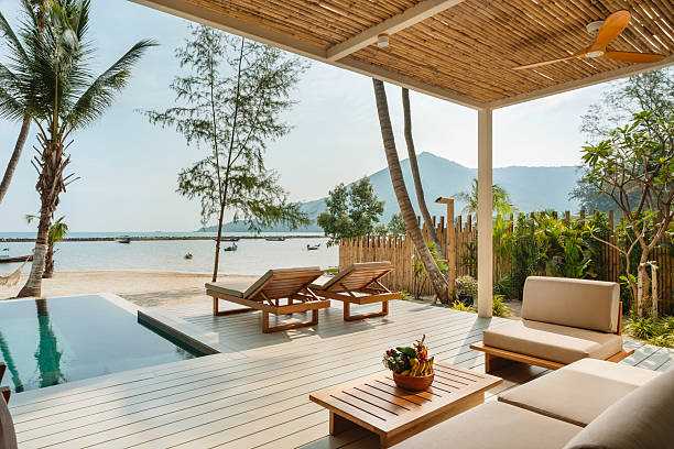 Relaxing deck chairs by the sea in tropical resort