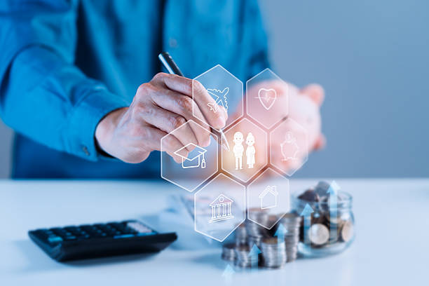 istock Man using a calculator and pointing at a screen, illustrating financial planning for retirement 2228613131