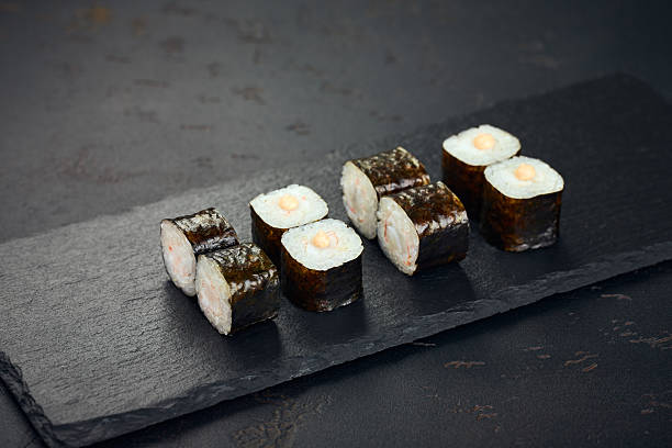 istock Roll with shrimp on dark background. Sushi menu. Japanese food. 2228616257