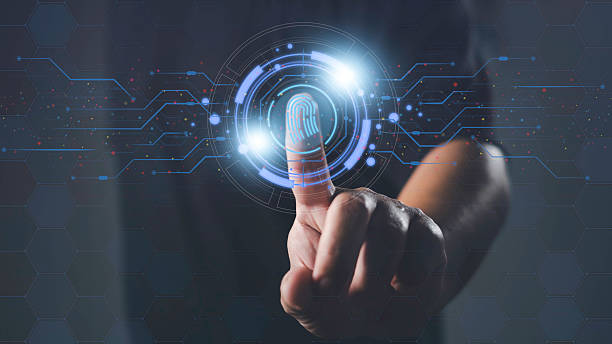 istock Biometric fingerprint authentication system. A person touches a digital fingerprint scanner interface for secure access, technology, identity verification, and cybersecurity concept. 2228619959