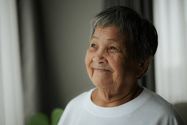istock Elderly contemplation by the window. 2228620077