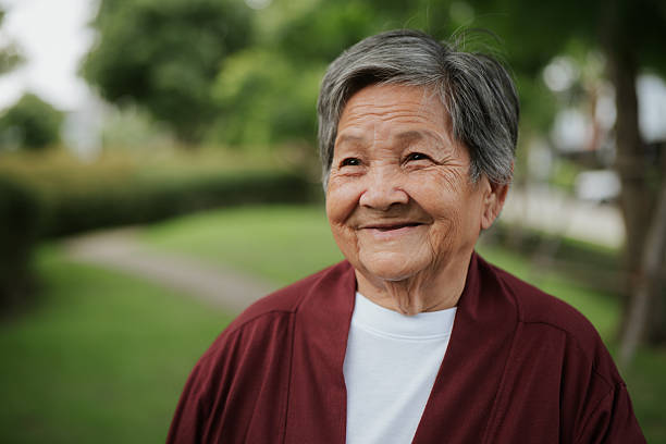 istock Elderly woman at park. 2228620214