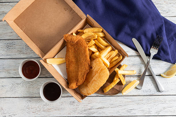 istock Delicious Fish and Chips Served With Condiments 2228624425