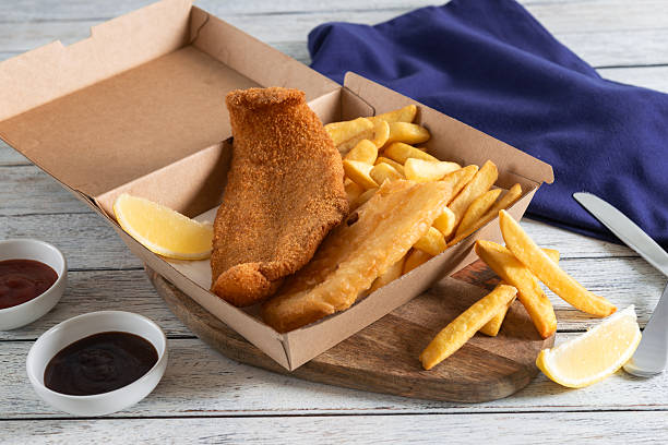 istock Delicious Fish and Chips Served With Lemon Slices 2228624538
