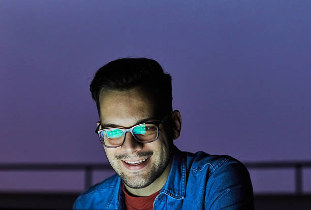 istock business young man night student laptop computer office guy businessman tv watching television movie startup evening glowing screen social media education 2228626113