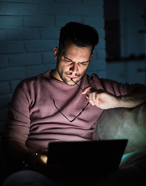 istock business young man night student laptop computer office guy businessman tv watching television movie startup evening glowing screen social media education 2228626549