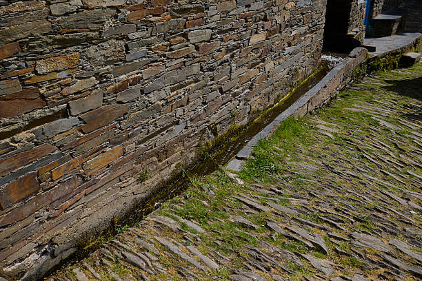 Mountain stream water flowing through a channel in the traditional Portuguese mountain village of Piodao.
