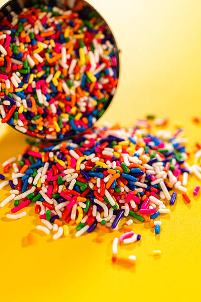 istock Candy sprinkles spilling from metal scoop 2228629489