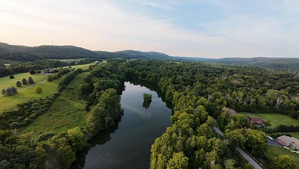 istock Lake with small islamd in the middle in a forest 2228629710